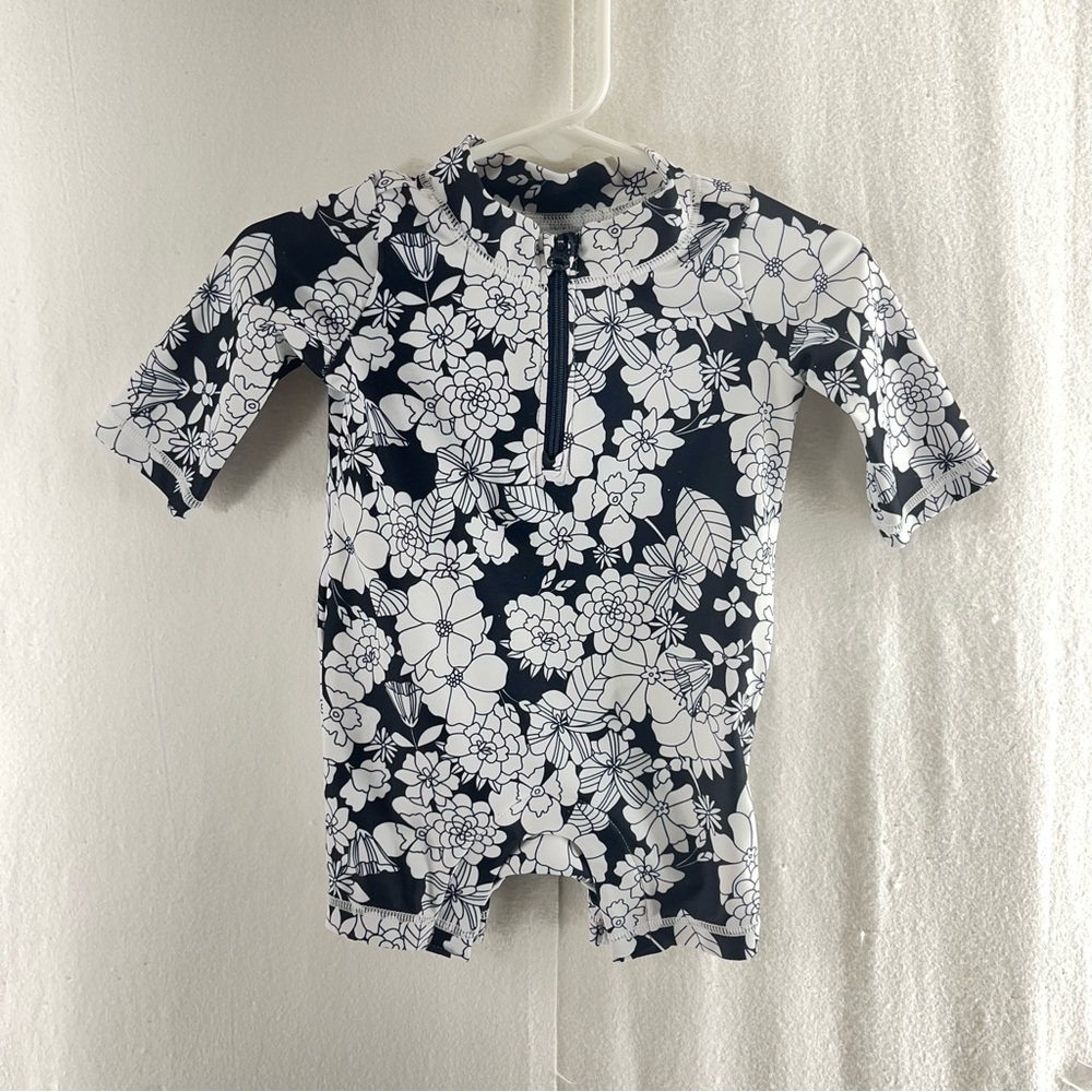 Let’s get the Holiday going with this Floral Kids Swimwear - Navy and White